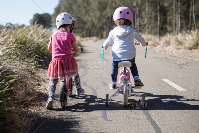 stock photo outdoors bicycle fun riding girl toddler friends children ride b694c836 800a 4985 a085 0eccd1d16690